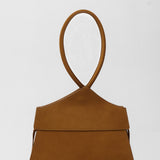 Brown suede handbag on a white background