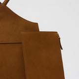 Brown suede bag on a white background