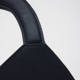 Close-up of a navy blue leather product on a white background