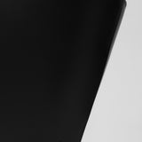 Black leather handbag with a minimalistic design on a white background